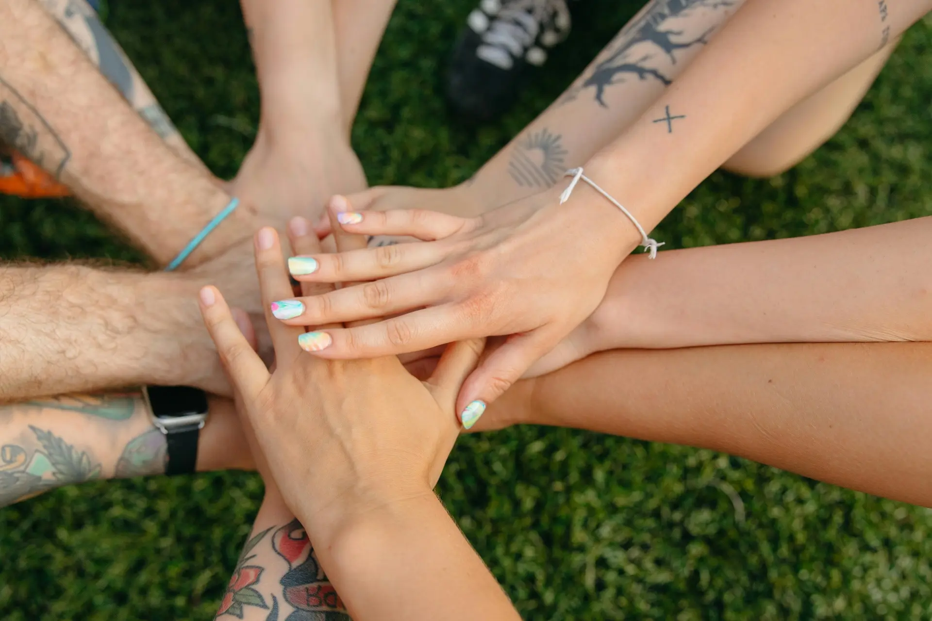 Diverse hands joined together representing community and unity